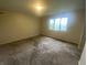 This spacious bedroom has large window that provides lots of natural light at 3202 Acacia Dr, Indianapolis, IN 46214