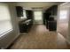 Bright kitchen with sleek black appliances and ample counter space at 3202 Acacia Dr, Indianapolis, IN 46214