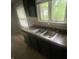 Functional kitchen featuring a stainless steel double sink under a bright window at 3202 Acacia Dr, Indianapolis, IN 46214