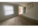 Inviting living room with carpet, natural light and staircase at 3202 Acacia Dr, Indianapolis, IN 46214