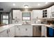 Bright kitchen featuring white cabinetry, stainless steel appliances, and modern countertops at 3300 E Indian Hill Dr, Muncie, IN 47302