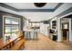 Bright kitchen with white cabinets and a dining area, creating a delightful space for meals and gatherings at 3300 E Indian Hill Dr, Muncie, IN 47302