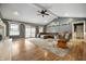 Inviting living room with a vaulted ceiling, ceiling fan, and wood floors, perfect for relaxing and entertaining at 3300 E Indian Hill Dr, Muncie, IN 47302