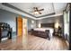 Spacious main bedroom features wood floors, tray ceiling, and opens to en-suite bathroom at 3300 E Indian Hill Dr, Muncie, IN 47302