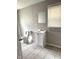 Bathroom featuring a vanity, mirror, toilet, and window with blinds at 3502 N Illinois St, Indianapolis, IN 46208