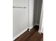 A view of a bathroom corner with a towel rack and brown floors at 3502 N Illinois St, Indianapolis, IN 46208