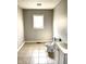 Bathroom featuring a toilet, vanity, and window with mini blinds at 3502 N Illinois St, Indianapolis, IN 46208