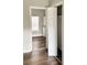 Bedroom with wood-look flooring with bathroom and closet in the view at 3502 N Illinois St, Indianapolis, IN 46208