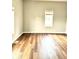 Bright bedroom featuring hardwood floors, neutral paint, and natural light from the windows at 3502 N Illinois St, Indianapolis, IN 46208