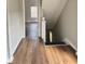 Inviting hallway featuring wood-look floors leading to the home's living space at 3502 N Illinois St, Indianapolis, IN 46208