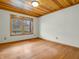 Bright bedroom with hardwood floors and a window with a backyard view at 3504 Morgan Oaks Cir, Martinsville, IN 46151