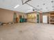Spacious garage with ample room for storage and projects, featuring a pegboard and bright lighting at 3504 Morgan Oaks Cir, Martinsville, IN 46151