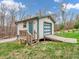 Detached garage with a ramp and stairs on a sunny day, offering accessibility and convenience at 3504 Morgan Oaks Cir, Martinsville, IN 46151