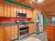 Updated kitchen showcasing stainless steel appliances, custom cabinets, and modern countertops at 3504 Morgan Oaks Cir, Martinsville, IN 46151