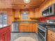 Charming kitchen featuring stainless steel appliances, wood cabinets, and a view of the outdoors at 3504 Morgan Oaks Cir, Martinsville, IN 46151