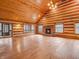 Bright living room boasts a brick fireplace, wood floors, and lots of natural light at 3504 Morgan Oaks Cir, Martinsville, IN 46151