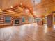 Spacious living room featuring wood floors, a brick fireplace, and multiple windows at 3504 Morgan Oaks Cir, Martinsville, IN 46151