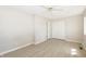 Bright bedroom with modern flooring, neutral paint, a closet and a ceiling fan at 3550 Winings Ave, Indianapolis, IN 46221
