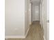 Hallway with modern flooring, neutral walls, with multiple doors at 3550 Winings Ave, Indianapolis, IN 46221