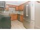 Modern kitchen with stainless steel appliances, tile backsplash, and updated cabinetry at 3550 Winings Ave, Indianapolis, IN 46221
