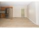 Eat-in kitchen features stainless steel appliances, modern flooring and neutral paint at 3550 Winings Ave, Indianapolis, IN 46221