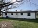 Back exterior of the home with a small patio and grassy lawn at 3689 S County Road 800 W, Coatesville, IN 46121