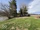 Backyard view showing a pond, grass, and trees at 3689 S County Road 800 W, Coatesville, IN 46121