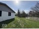 View of the backyard with the home adjacent to a pond at 3689 S County Road 800 W, Coatesville, IN 46121