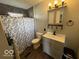 Updated bathroom with a modern vanity, toilet, and shower at 3689 S County Road 800 W, Coatesville, IN 46121