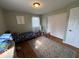 Bedroom with hardwood floors, a dinosaur themed bedspread, a large rug, and closet for convenient storage at 3689 S County Road 800 W, Coatesville, IN 46121