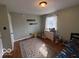 This bedroom features hardwood floors and a neutral color palette at 3689 S County Road 800 W, Coatesville, IN 46121