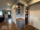 Inviting entryway with hardwood floors, gray storage, and a convenient pantry for seamless organization at 3689 S County Road 800 W, Coatesville, IN 46121