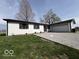 Charming single-story home with a white brick exterior and gravel driveway at 3689 S County Road 800 W, Coatesville, IN 46121