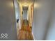 Hallway featuring hardwood floors and neutral paint, creates a cohesive and welcoming atmosphere at 3689 S County Road 800 W, Coatesville, IN 46121