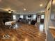 Spacious living room with a stone fireplace, wood floors, recessed lighting, and lots of natural light at 3689 S County Road 800 W, Coatesville, IN 46121