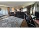 Spacious living room boasts hardwood floors, a stone fireplace, and lots of seating at 3689 S County Road 800 W, Coatesville, IN 46121
