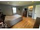 Large bedroom featuring hardwood floors and an ensuite bathroom at 3689 S County Road 800 W, Coatesville, IN 46121