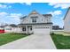Beautiful two-story home featuring a two-car garage and a spacious, green lawn at 3787 Thomas Jefferson St, Westfield, IN 46074