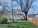 Nice backyard featuring lush green grass with wooden fence at 408 E Beecher St, Indianapolis, IN 46225