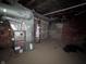 Unfinished basement featuring a furnace and a water heater at 408 E Beecher St, Indianapolis, IN 46225