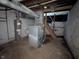 Unfinished basement with water heater and other mechanical equipment at 408 E Beecher St, Indianapolis, IN 46225