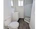 Bathroom featuring a vanity, toilet, and shower at 408 E Beecher St, Indianapolis, IN 46225