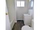 Bathroom with tub and shower combination, vanity, and window at 408 E Beecher St, Indianapolis, IN 46225