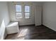 This bedroom has hardwood floors, two windows, and a closet at 408 E Beecher St, Indianapolis, IN 46225