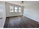 Bright bedroom features three windows and wood-look floors at 408 E Beecher St, Indianapolis, IN 46225