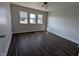 Spacious bedroom with hardwood floors and three windows for ample light at 408 E Beecher St, Indianapolis, IN 46225