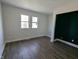 The bedroom boasts hardwood floors and great natural light at 408 E Beecher St, Indianapolis, IN 46225