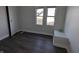 Bedroom features hardwood flooring and a double window for natural light at 408 E Beecher St, Indianapolis, IN 46225