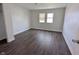 An empty bedroom space featuring hardwood flooring, white paint and natural lighting at 408 E Beecher St, Indianapolis, IN 46225