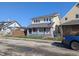 Shot of two-story home with fenced front yard at 408 E Beecher St, Indianapolis, IN 46225